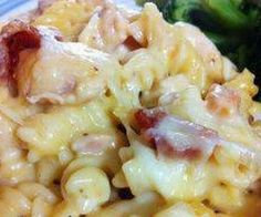 closeup of pasta with ham and cheese on it, as well as broccoli