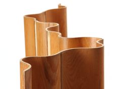 three wooden vases sitting next to each other