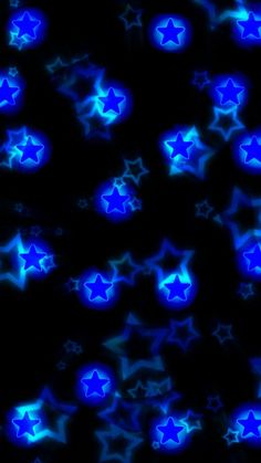 many blue stars are glowing in the dark