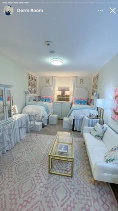 a living room filled with furniture next to a white couch and coffee table on top of a rug