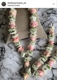 the flowers are arranged on the necklace