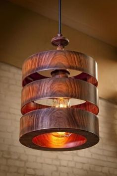 a wooden light fixture hanging from the ceiling