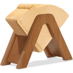 the wooden stool is shaped like an elephant's tail and has been made out of plywood