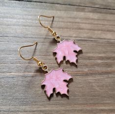 Lightweight 18k gold plated stainless steel light pink resin filled gold maple leaf earrings. Earrings are 1 inch long.  Be sure to check out more HANDMADE jewelry in my shop, DizzleBees, beautiful jewelry of all kinds available! Made with quality materials and always nickel and lead free metals ♡ Perfect gift for a friend or loved one: All jewelry pieces are packaged in silver silk jewelry pouches, wrapped carefully, and packaged with love. Beautiful wrapping for gift ready giving. Personalized gift messages available. See Gift Wrapping at checkout) STAY CONNECTED!! Follow and like my shop, DizzleBees! I am available all hours of the day to help with orders, answer questions, and anything else you need ♡ Message me on Etsy, I'll respond in minutes! New additions rolling in every day, and Pink Enamel Jewelry With Matching Earrings, Pink Enamel Dangle Jewelry, Pink Enamel Earrings For Gift, Hypoallergenic Leaf-shaped Jewelry Gift, Hypoallergenic Pink Gold Earrings Gift, Rose Gold Leaf-shaped Jewelry For Gifts, Rose Gold Leaf-shaped Jewelry Gift, Steel Light, Silk Jewelry