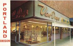 an old photo of a store front with the word portland on it's side