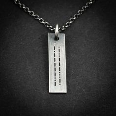 Sterling silver personalized engraved Morse code necklace. The beauty of a Morse code necklace lies in its ability to convey a hidden and personal message. The message can be anything you desire, from a loved one's name, a meaningful date, a motivational phrase, or a secret message that only you and a select few know how to decode. Furthermore, if you have a specific design in mind or would like a different font for the engraving, please don't hesitate to reach out to me. I'm here to assist you Code Morse, Morse Code Necklace, Message Necklace, Jewelry Mens, Minimalist Gifts, Morse Code, Custom Pendants, Secret Messages, Engraved Necklace