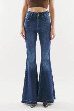 Our Cinthia Ultra High Rise Jeans come in a superflare cut with a raw, released hem that creates a chic, rustic look. Sits high above the natural waistline as it tapers down the thigh and begins to flare out at the calf. Made with stretch denim that holds its shape and allows you to move with ease. Features a classic five-pocket design, single-button front, and zip-fly closure. 11.25" Rise / 33.5" Inseam (Size 3/25) 68% Cotton, 27% Polyester, 3% Rayon, 2% Spandex Model in size 3/25 Style # : KC7896D Style # : KC7896M Stretchiness Level >> Stretch Fitted Flares With Frayed Hem For Fall, Fitted Flares With Frayed Hem, Dark Flare Jeans, Super Flare Jeans, Denim Flare Jeans, Flare Denim Jeans, Cute Jeans, Denim Flares, Cute Sweaters