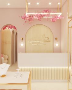 the interior of a jewelry store with pink flowers hanging from the ceiling and lights on the walls