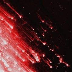 an abstract red and black background with small dots