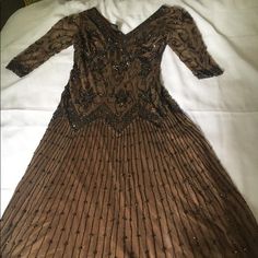 an old dress is laying on a bed