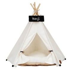 a white teepee with black lettering on it