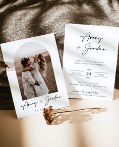 two wedding cards with an image of a couple hugging each other on top of a bed