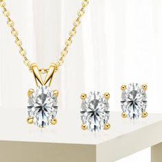 Indulge in timeless glamour with this exquisite oval cut jewelry set, featuring a resplendent 1-carat moissanite necklace and matching 0.5-carat earrings. Crafted from sterling silver and available in a choice of lustrous white gold or radiant yellow gold, this set is an embodiment of sophistication, elevating any occasion with its brilliant sparkle and refined elegance. Description Oval Cut Moissanite Stones Clear Color Stones 0.5ct Earrings 1.0ct Necklace Sterling Silver All Occasions GRA Certified Timeless Glamour, Moissanite Necklace, Color Stones, Moissanite Jewelry, Silver Pendant Necklace, Gold Plated Silver, 1 Carat, Gold Plated Sterling Silver, Earrings Jewelry