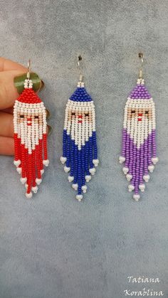 three beaded santa claus earrings in different colors