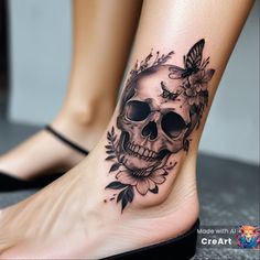 a woman's foot with a skull and flowers on it