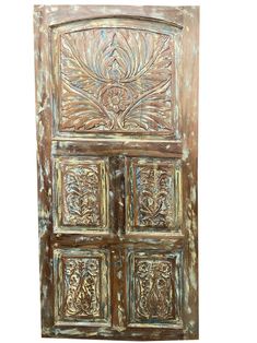 an old wooden door with ornate carvings on it