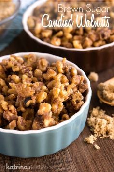 brown sugar candied walnuts in blue dishes on a wooden table with spoons