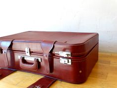 "Suitcase, Travel Luggage, Feaux Leather Valise, Suitcase Table, Luggage Bag, A vintage (1980) travel suitcase,covered with feux leather in Bordeaux colour. At the back side you can read a Greek travel number : 2238717/ 3δ (delta \"D\" ) The suitcase is in excellent condition (used) with some rustic spots upon metal parts.. The interior part is in very good (used) condition.. Please check all photos.. Feaux Leather Suitcase Dimensions: Base : 68 x 42.5 cm or 26.77 x 16.73 inches Height: 19.8 cm Brown Rectangular Travel Case, Brown Cases With Luggage Sleeve For Trip, Rectangular Cases With Luggage Sleeve For Storage, Brown Rectangular Cases For Trip, Rectangular Brown Cases For Trip, Brown Rectangular Cases For Trips, Rectangular Case With Luggage Sleeve For Storage, Brown Rectangular Storage Case, Classic Rectangular Storage Cases