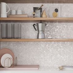 the shelves in this kitchen are filled with dishes and other items, including coffee maker