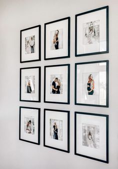 six black and white framed photographs hanging on the wall in front of a couple holding each other