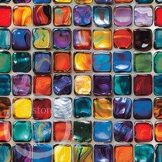 multicolored glass tiles are arranged in rows