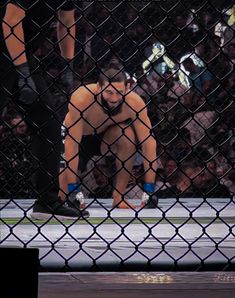 a man standing on top of a wrestling ring