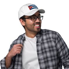 Show off your patriotic spirit with our Embroidered Dad Hat With Cuba Flag! This stylish hat features a beautifully embroidered Cuba flag on the front side, making it the perfect accessory for any proud Cuban. See more Cuba items Available in a range of colors including Navy, White, Black, Cranberry, Green Camo, and Pink, you can choose the one that best suits your style. The adjustable strap with an antique buckle ensures a comfortable fit for everyone. Whether you're celebrating Revolution Day Cuba Flag, Stripe Outfits, Jersey Sweatshirt, Stylish Hats, Sport Bh, Green Camo, Dad Hat, Cool Suits, Rash Guard