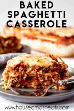 baked spaghetti casserole on a plate with a fork and another dish in the background