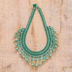 This dramatic beaded waterfall necklace is the original creation of Mirian Zet in Guatemala. The artisan strings viridian aqua and gold crystal and glass beads in elaborate patterns to create the necklace which is secured by a beaded toggle clasp. Na'vi Culture, Avatar Clothes, Beaded Toggle Clasp, Aqua And Gold, Waterfall Necklace, Handmade Jewlery, Buy Bead, Gold Crystal, Jewelry Outfit