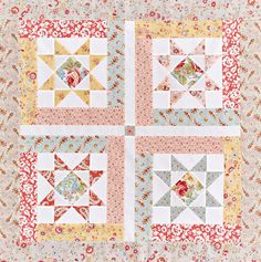 four quilts are arranged on top of each other