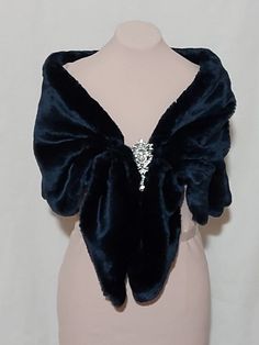 This elegant dark blue faux fur capelet was designed for that special day or evening wedding. The design of this capelet is elbow length. (Measures Approx 18" , Will Fit Up To 45 inch circumference (Fits Small -Plus size)  Since every garment is created  for you-  For best accurate results, measure yourself& compare with the detailed size chart below:  fur capelet with bow closure length                        small          40 in medium     43 in large          47 in INSTRUCTIONS WHEN ORDERING: Blue Fur Jacket, Blue Outfit Winter, Fur Capelet, Short Fur Coat, Fur Shawl Wedding, Winter Cloak, Dark Blue Wedding, Blue Winter Wedding, Fox Scarf