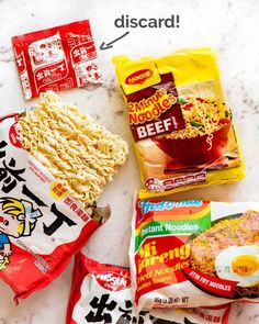 an assortment of ramen, noodles and eggs on a marble counter top with japanese characters