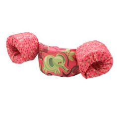 an elephant headband with pink polka dots on the front and green elephants on the back