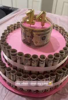 a cake made to look like money with the number four on top