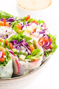 a salad with lettuce, carrots and red cabbage