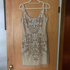 Stunning Nude Cocktail Dress. Many Embellishments. Worn Once - Noticed A Few Of Sequins On Side Have Come Off But Not Noticeable. Fully Lined And In Great Condition!! Make Me An Offer. Champagne Embellished Mini Dress For Formal Occasions, Champagne Embellished Mini Dress For Formal Events, Formal Embellished Champagne Mini Dress, Dressy Embellished Mini Dress For Wedding, Elegant Embellished Champagne Mini Dress, Elegant Champagne Embellished Mini Dress, Dressy Embellished Evening Dress For Holiday, Holiday Embellished Sequin Dress, Dressy Embellished Sequin Wedding Dress