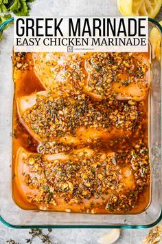 greek marinade in a glass casserole dish with lemons and herbs