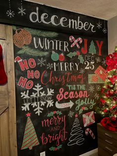 a chalk board with christmas decorations on it