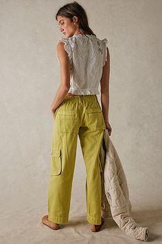 The coolest way to cargo, these timeless pants are featured in a low-rise, slouchy straight silhouette with utility-style pockets throughout and smocked waist for ease. * Zip fly and button closure * Drawstring waist feature * Oversized pockets throughout * Ankle-length | Tahiti Cargo Pants by Free People in Green, Size: XS Spring Parachute Pants With Flap Pockets, Casual Cropped Bottoms With Cargo Pockets, Cropped Utility Bottoms For Fall, Casual Cropped Cargo Pants With Pockets, Fall Cropped Utility Bottoms, Chic Parachute Pants With Cargo Pockets, Spring Relaxed Fit Parachute Pants With Flap Pockets, Loosely Fitted Cargo Jeans With Pockets For Spring, Spring Utility Parachute Pants With Flap Pockets