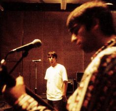 two men in a recording studio with microphones