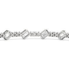 Designed with transitional appeal, this tennis bracelet elegantly combines rounded edges with crisp and clean lines. It features bezel-set emerald-cut diamonds set on stations along a series of claw-prong-set round diamonds. The two diamond cuts brilliantly work together, sparkling simultaneously. Modern Diamond Tennis Bracelet With Baguette Cut, Modern Diamond Cut Tennis Bracelet For Anniversary, Modern Diamond Bracelet With Baguette Cut Accents, Modern Baguette Cut Diamond Bracelet For Anniversary, Modern Baguette Cut Diamond Bracelet With Accents, Modern Baguette Cut Tennis Bracelet For Anniversary, Modern Baguette Cut Diamond Bracelet, Formal Cubic Zirconia Tennis Bracelet With Rectangular Links, Emerald Cut Diamond Tennis Bracelet