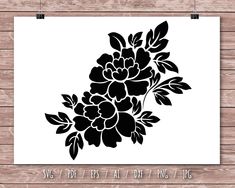 a black and white flower stencil on a wooden background with the words svg files