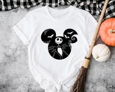 a mickey mouse halloween shirt with bats on it