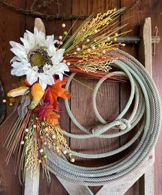 a wreath made out of rope and flowers