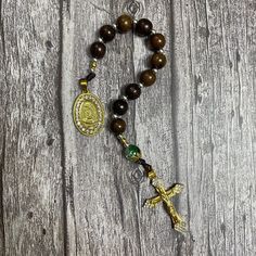 Black and gold-tone Catholic Pocket Rosary with green gemstone beads, Rosary for Her, Catholic Gifts, First Communion Gift, Catholic Rosary This exquisite pocket rosary is meticulously fashioned using 10mm beads made from the rich green cypress wood, complemented by delicate ornamental beads and accompanied by 10mm gemstone beads. Showcasing a graceful 1.6-inch crucifix, alongside a devotional medal portraying Mother Mary, this addition further enriches its inherent sacred charm. ➡️ NOTE: - Fini Gold Rosary Bracelet With Gemstone Beads As Gift, Gold Beaded Rosary Bracelet For Healing, Gold Spiritual Rosary Bracelet For Healing, Gold Rosary With Gemstone Beads Gift, Handmade Gold Rosary For Healing, Gold Spiritual Rosary With Gemstone Beads, Handmade Gold Healing Rosary, Gold Rosary With 8mm Beads For Healing, Gold Gemstone Beads Rosary