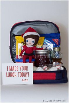 an open lunch bag with a doll in it and a sign that says i made your lunch today