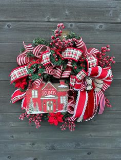 a christmas wreath with red and white decorations