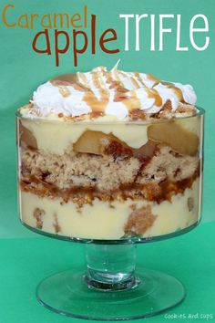 a close up of a dessert in a glass dish on a green background with the title caramel apple trifle