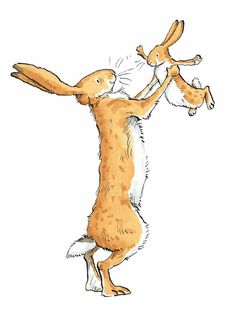 a brown and white rabbit standing on its hind legs with it's front paws in the air