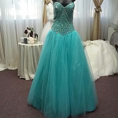 Turquoise Tulle Jeweled Bodice With Laced Up Back With Glitter Tulle Bolaro. Measurements B37 W30 H40 Because Of Lace Back Can Go Up Or Down Size Floor-length Light Blue Gown For Quinceanera, Turquoise Fitted Prom Dress, Green Floor-length Dress For Quinceanera, Turquoise Fitted Evening Dress For Wedding, Fitted Turquoise Evening Dress For Wedding, Floor-length Turquoise Gown For Party, Turquoise Floor-length Gown For Party, Turquoise Fitted Prom Evening Dress, Turquoise Fitted Evening Dress For Prom